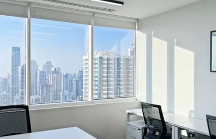 Bright coworking space with stunning skyline views, ergonomic seating, and modern design.
