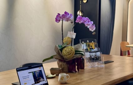 Stylish coworking space with elegant decor, ample seating, and modern lighting on Duddell Street.