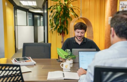 Modern coworking space with bright decor and collaborative desk setup in Lockhart Road.