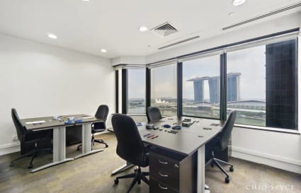 Bright coworking space with stunning views of Marina Bay. Ideal for collaboration and productivity.