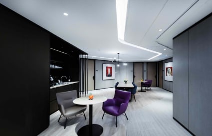 Stylish coworking space with modern seating and sleek lighting, perfect for collaboration.