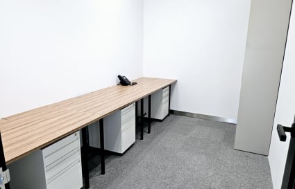 Efficient private workspace with ample desk space and storage, ideal for focused productivity.