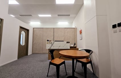 Modern coworking space with sleek furniture and ample lighting on Wang Chiu Road.
