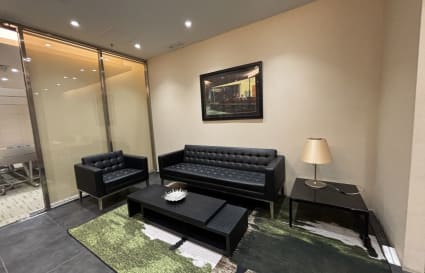 Stylish coworking lounge with plush seating and modern decor on Kwun Tong Road.