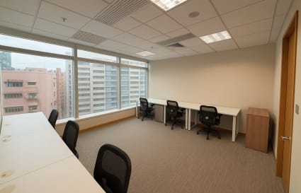 Bright, spacious coworking space with modern desks and city views. Perfect for collaboration.