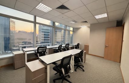 Bright coworking space in Kwun Tong with ergonomic chairs and natural light.