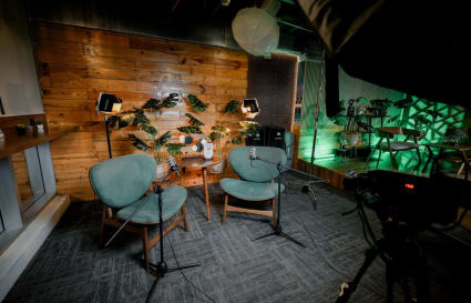 Cozy coworking space in Pasig with stylish seating, ambient lighting, and a modern wooden backdrop.