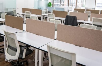 Bright, modern coworking space with ample natural light and shared desks. Ideal for collaboration.
