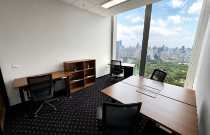 Bright coworking space in Bang Rak with stunning city views and modern furnishings.