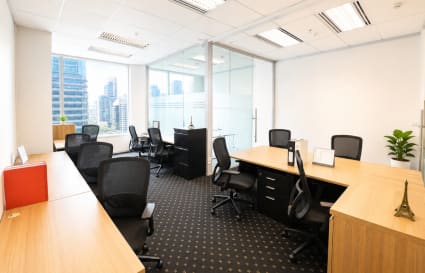 Bright, flexible workspace with city views, ergonomic chairs, and modern furnishings in Pathumwan.