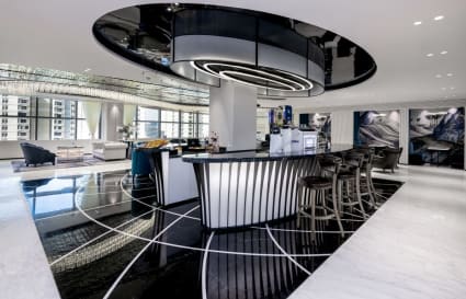 Elegant coworking space with a chic bar and modern seating on Sheikh Zayed Road, Dubai.