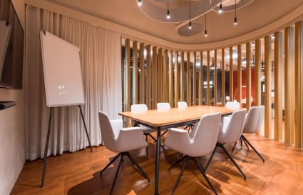 Modern conference room with sleek table, ergonomic chairs, and ambient lighting in Causeway Bay.