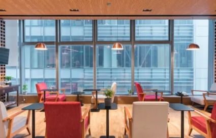 Modern coworking area in Causeway Bay with ample natural light and stylish seating.