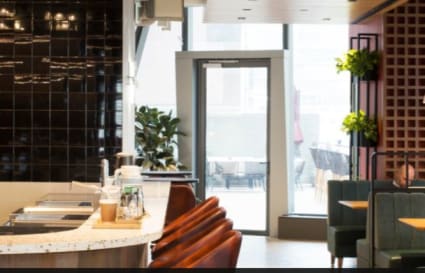 Stylish coworking space in Causeway Bay. Modern seating, natural light, and inviting decor.
