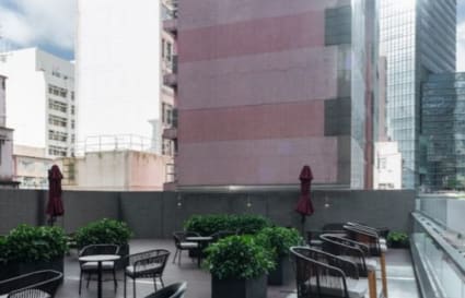 Rooftop terrace with seating and greenery—ideal for casual meetings in Causeway Bay.