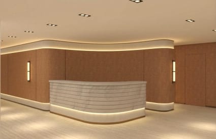 Sleek reception area with elegant marble desk and ambient lighting in Admiralty coworking space.