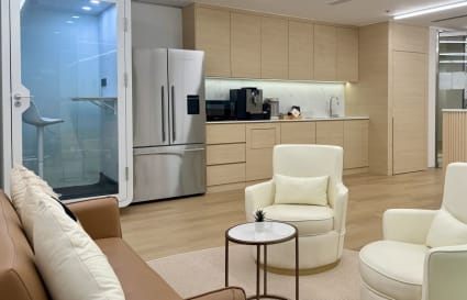 Modern coworking space with comfy seating, kitchenette, and private booth in Taikoo Shing.