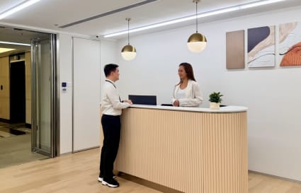 Welcoming reception area with modern decor and natural lighting in Taikoo Shing coworking space.