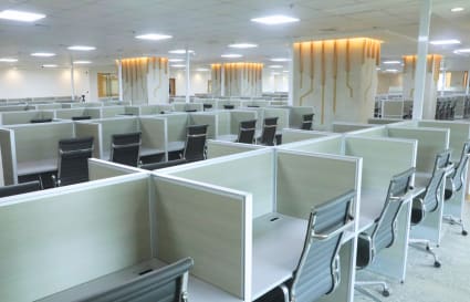 Spacious modern coworking area with individual workstations and ample lighting in Salinas Drive.