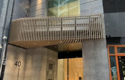 Modern coworking entry in Sheung Wan with sleek design and inviting ambiance.