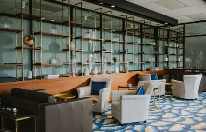 Stylish coworking lounge with modern decor and ample seating in vibrant Singapore.
