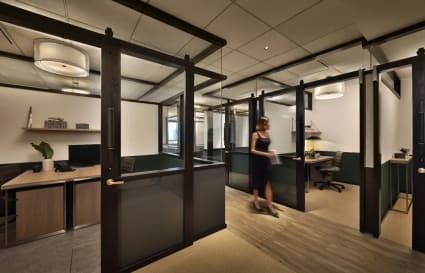 Modern coworking space with private offices and elegant furnishings in Orchard Road.