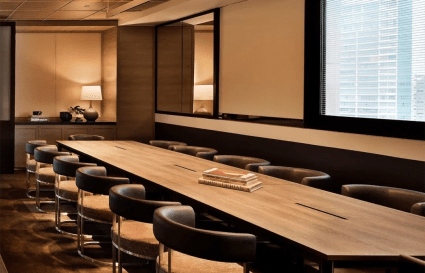 Sophisticated conference room with elegant seating and natural lighting in Orchard Road coworking space.