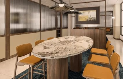 Stylish Singapore coworking space with a modern oval table and inviting seating.