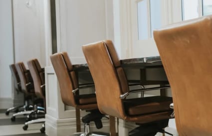 Sleek coworking space with stylish chairs and natural lighting in Singapore. Ideal for productivity.