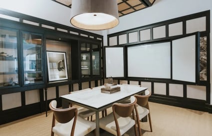 Elegant meeting space with modern design, ample natural light, and contemporary furniture. Perfect for collaboration.