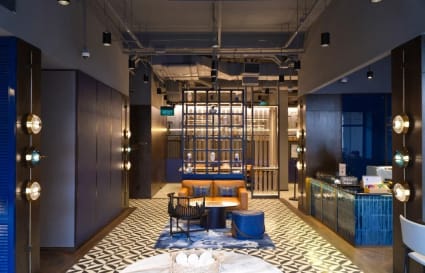 Stylish coworking space with modern decor and ample seating. Ideal for creative collaboration.
