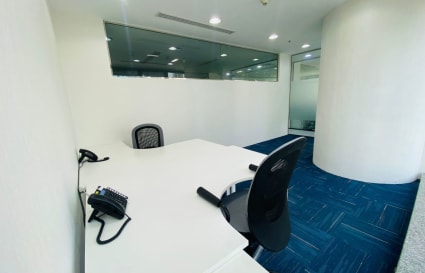 Sleek, modern workspace with glass partitions and ergonomic seating in Marasi Drive, Dubai.
