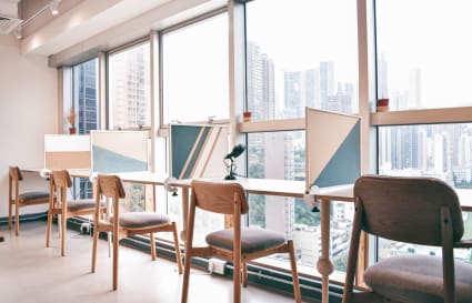 Bright, modern coworking space with large windows and city views on Leighton Road.
