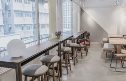 Bright, airy coworking space with modern furnishings and abundant natural light, ideal for collaboration.