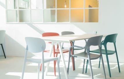 Bright coworking space with modern chairs and ample natural light on How Ming Street.
