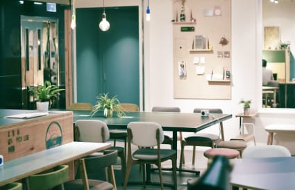 Stylish coworking space with modern decor, ample seating, and creative ambiance.
