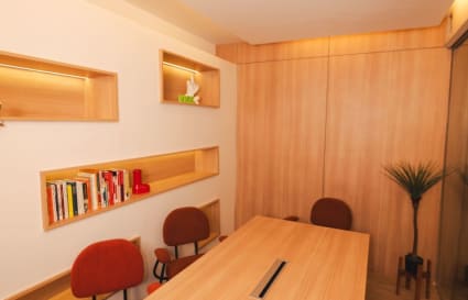 Warm, inviting meeting space with modern wood accents and soft lighting for productive sessions.