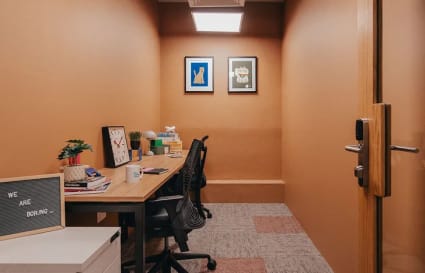 Cozy coworking space with modern decor, ergonomic chairs, and ample desk space in Gateway Drive.