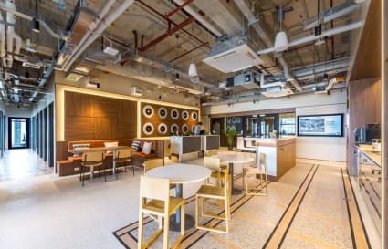 Modern coworking space with open seating, sleek design, and bright lighting in Metro Manila.