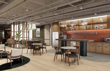 Modern coworking space with stylish seating, open plan, and a fully equipped kitchen area.