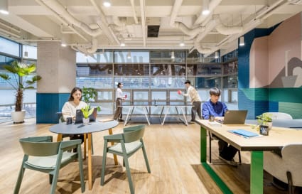 Vibrant coworking space with modern furniture and natural light in Gangnam District.