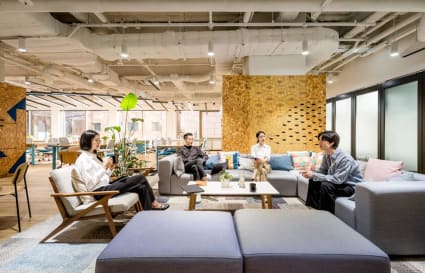 Modern coworking space with cozy seating and vibrant decor in Jung District. Ideal for collaboration.