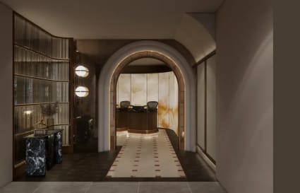Elegant coworking space with warm lighting, sophisticated archway, and modern decor.