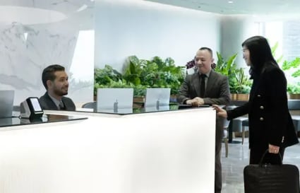 Welcoming reception area with lush greenery and modern design in Kebayoran Baru coworking space.