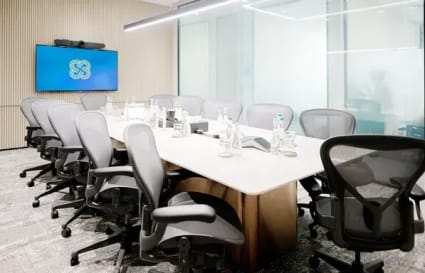 Modern conference room with ergonomic chairs, sleek design, and advanced AV setup in Jakarta.