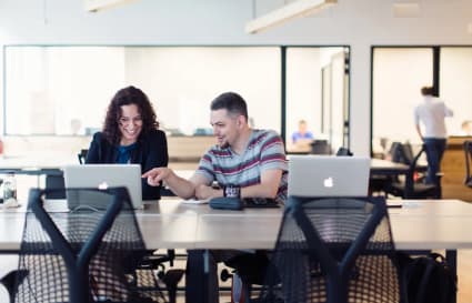 Vibrant coworking space with modern desks and collaborative environment in Singapore.