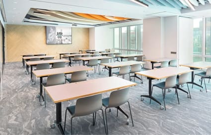 Bright, spacious coworking area with modular desks and abundant natural light. Ideal for collaboration.