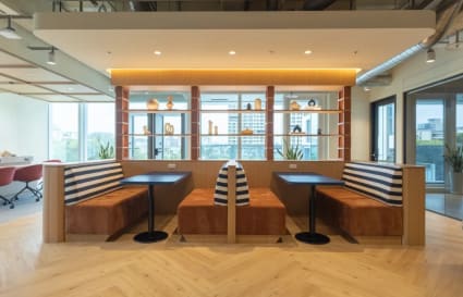Stylish seating with natural light and modern decor in Taipei's flexible coworking space.