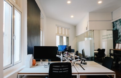 Bright, flexible workspace with modern desks and ample natural light on Club Street, Singapore.