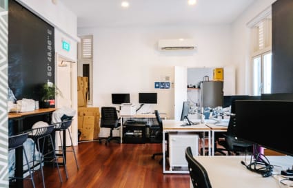 Bright, flexible workspace in Club Street. Modern desks, seating, and natural light enhance productivity.